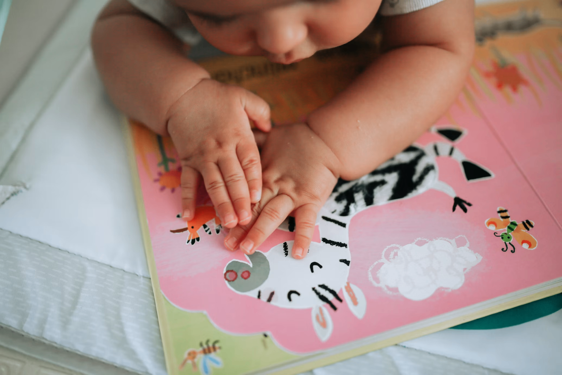 Child reading a colorful picture book